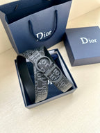 Black Dior monogram belt with oversized logo buckle and textured strap detail