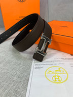 Leather belt with dark brown strap and silver buckle, two sides shown
