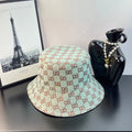 Bucket cap with GG monogram pattern, light teal and cream with red-brown accents