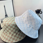 Bucket cap set: teal/cream GG cap and light blue cap with subtle monogram print