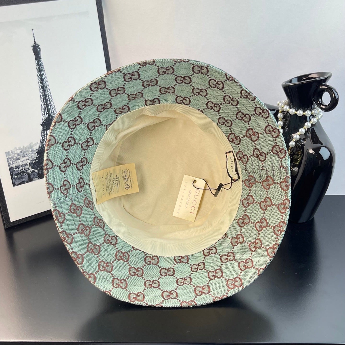 Bucket cap inside view with cream lining and brand tags on the crown