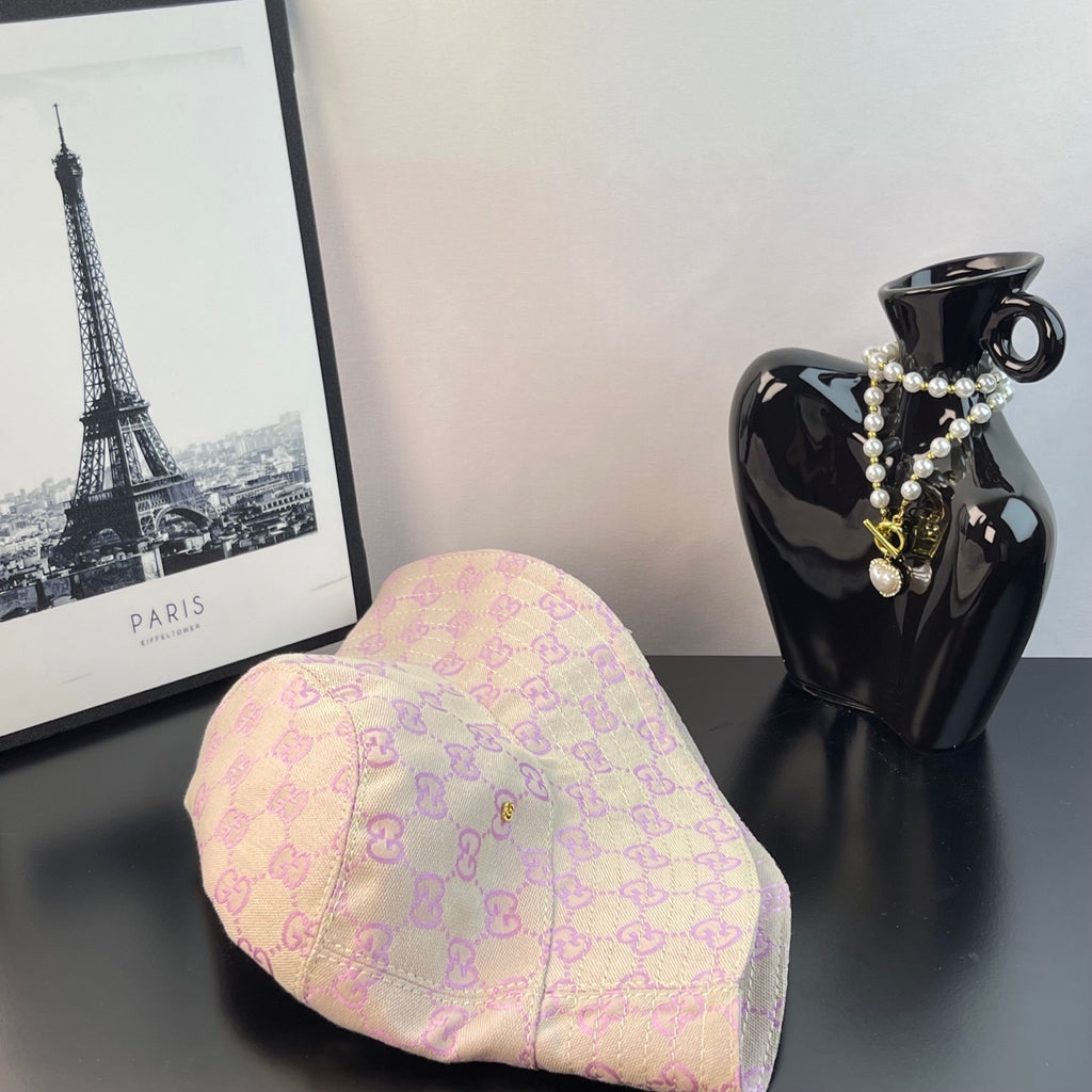 Pink Gucci GG monogram bucket hat angled view with curved brim