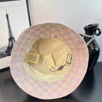 Gucci GG monogram bucket hat showing tan interior lining and hanging tags