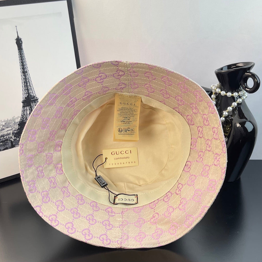 Gucci GG monogram bucket hat interior view with tan lining and labels