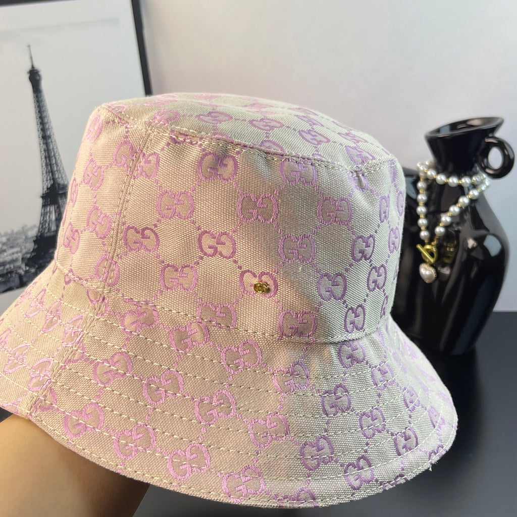 Pink Gucci GG monogram bucket hat close-up with textured fabric and seam