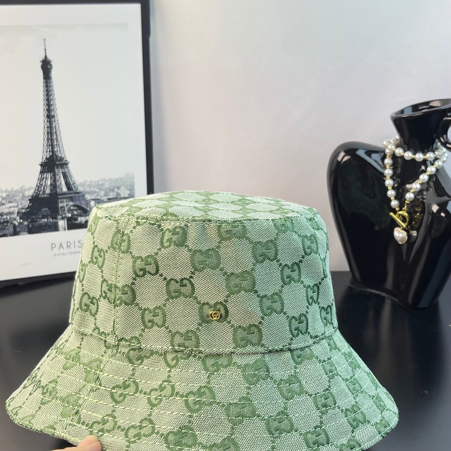 Gucci GG monogram bucket hat in light green, front view with textured woven look