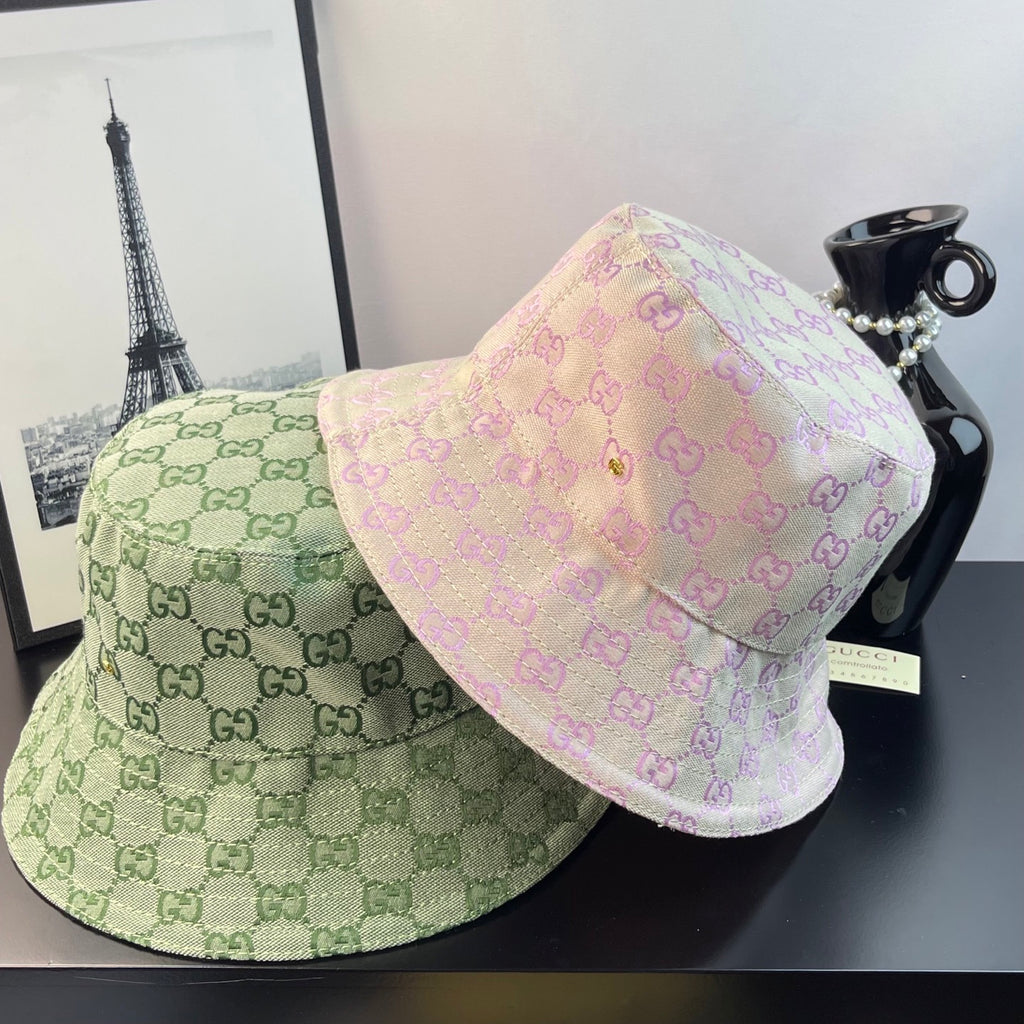 Gucci GG monogram bucket hats: light green and pale pink with matching patterned fabric