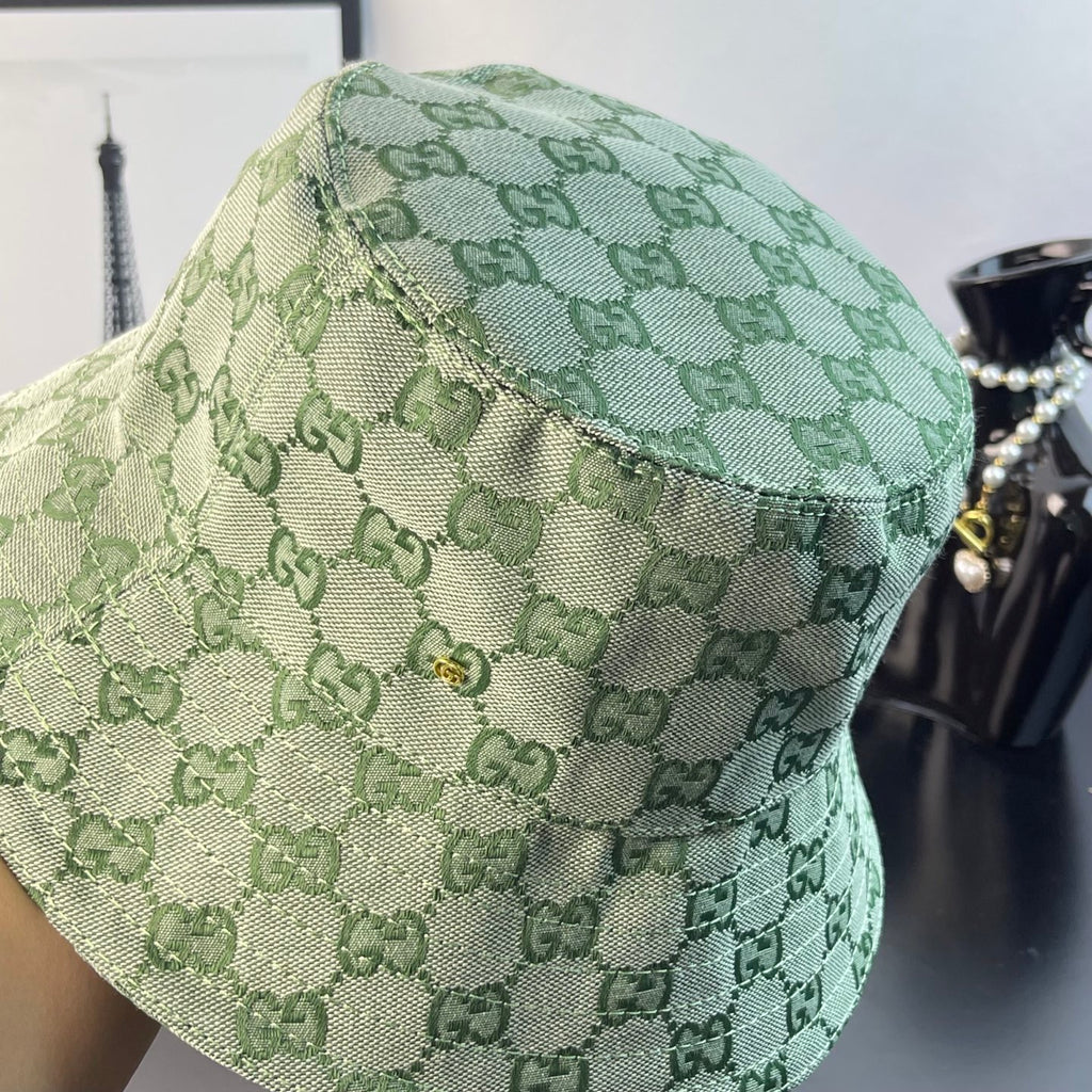 Gucci GG monogram bucket hat in light green, close-up of stitched brim edge
