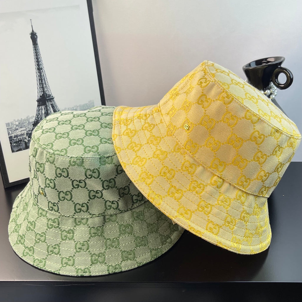 Gucci GG monogram bucket hats: light green and bright yellow with all-over pattern
