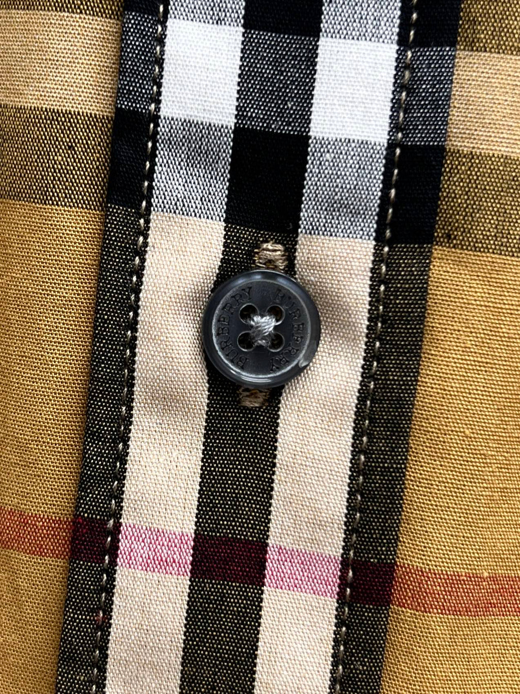 Plaid shirt with round button on front placket