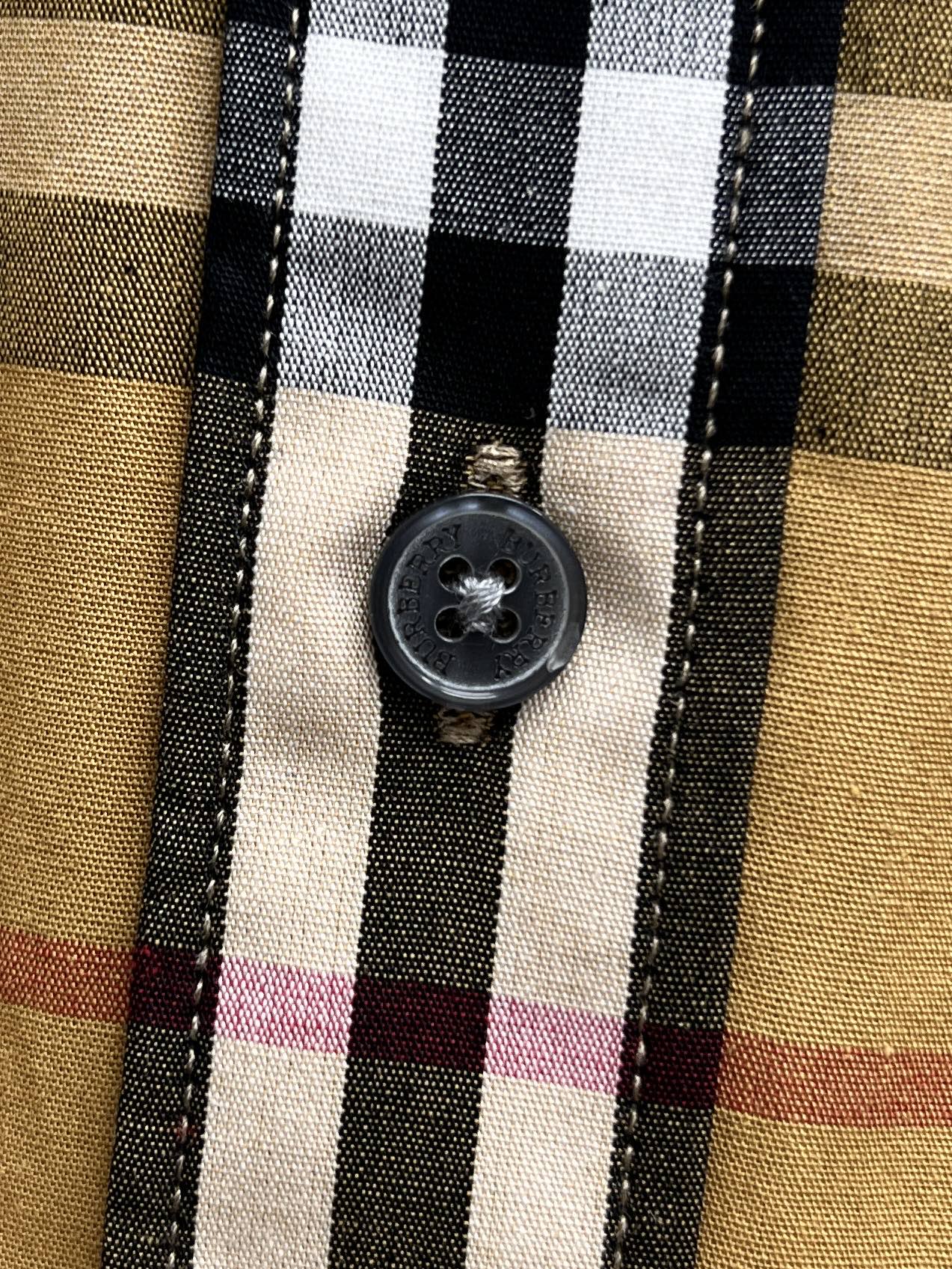 Plaid shirt with round button on front placket
