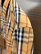 Plaid shirt sleeve with stitched seam and cuff detail