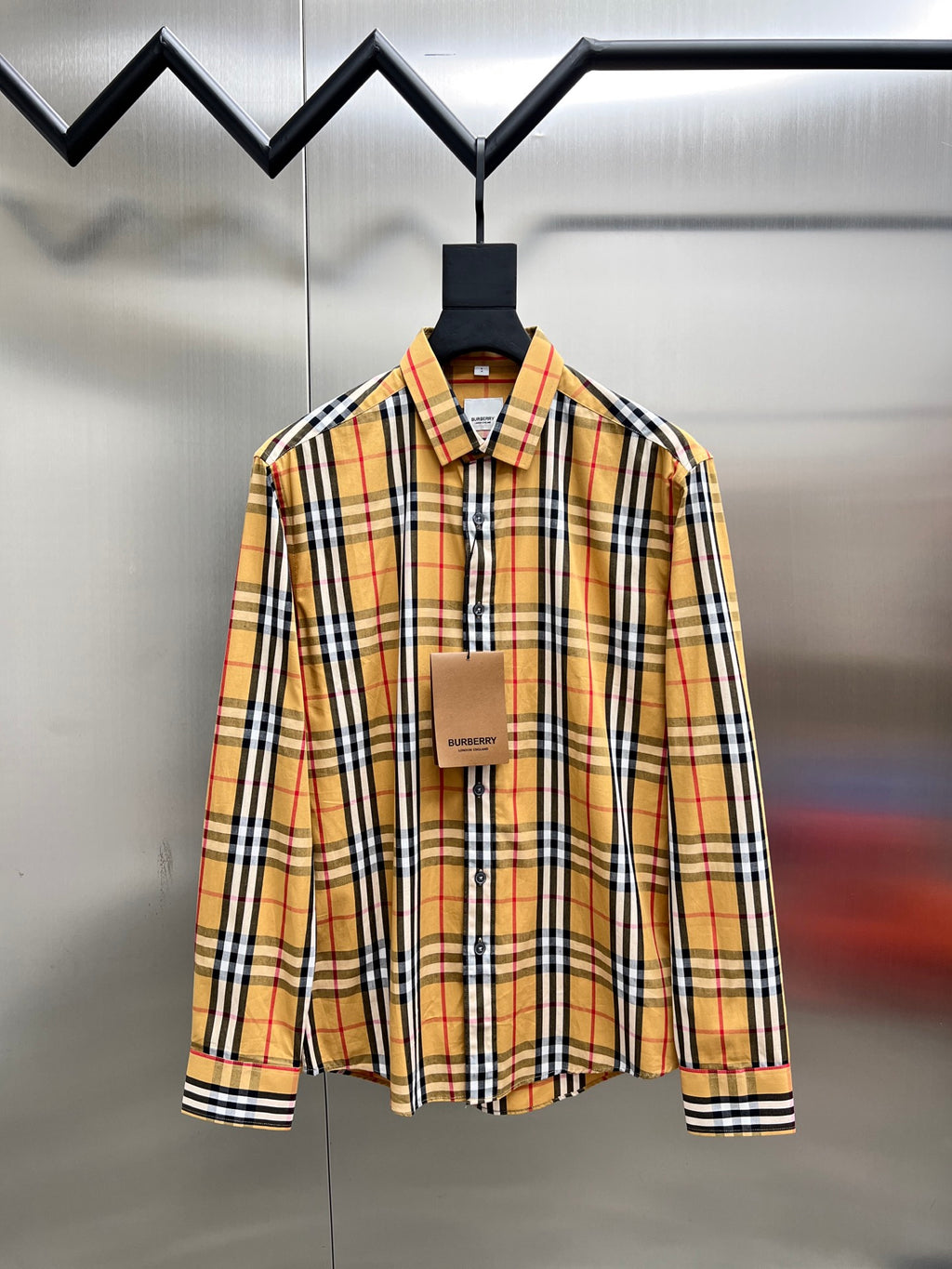 Plaid button-up shirt with long sleeves, front button placket and collar