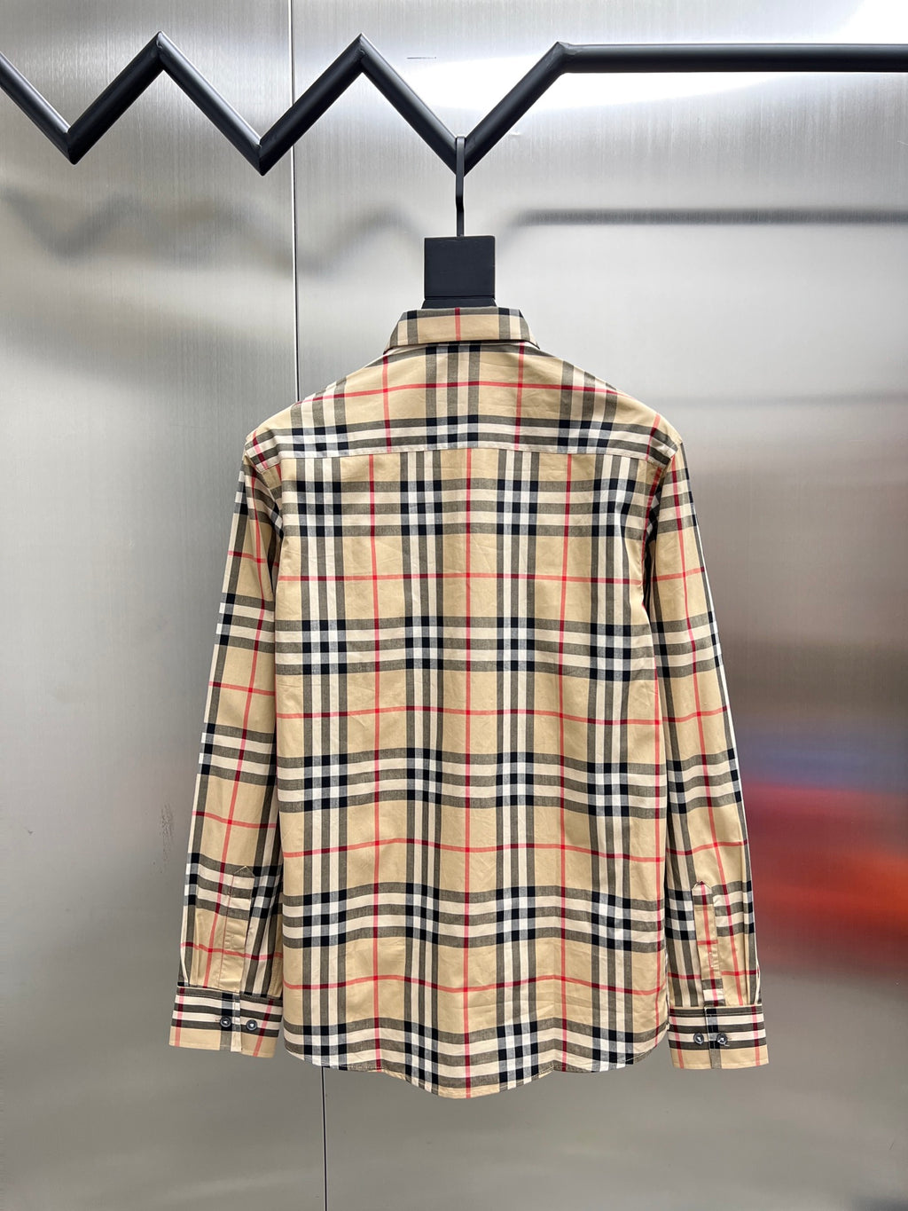 Burberry long-sleeve plaid button-up shirt on hanger, back view