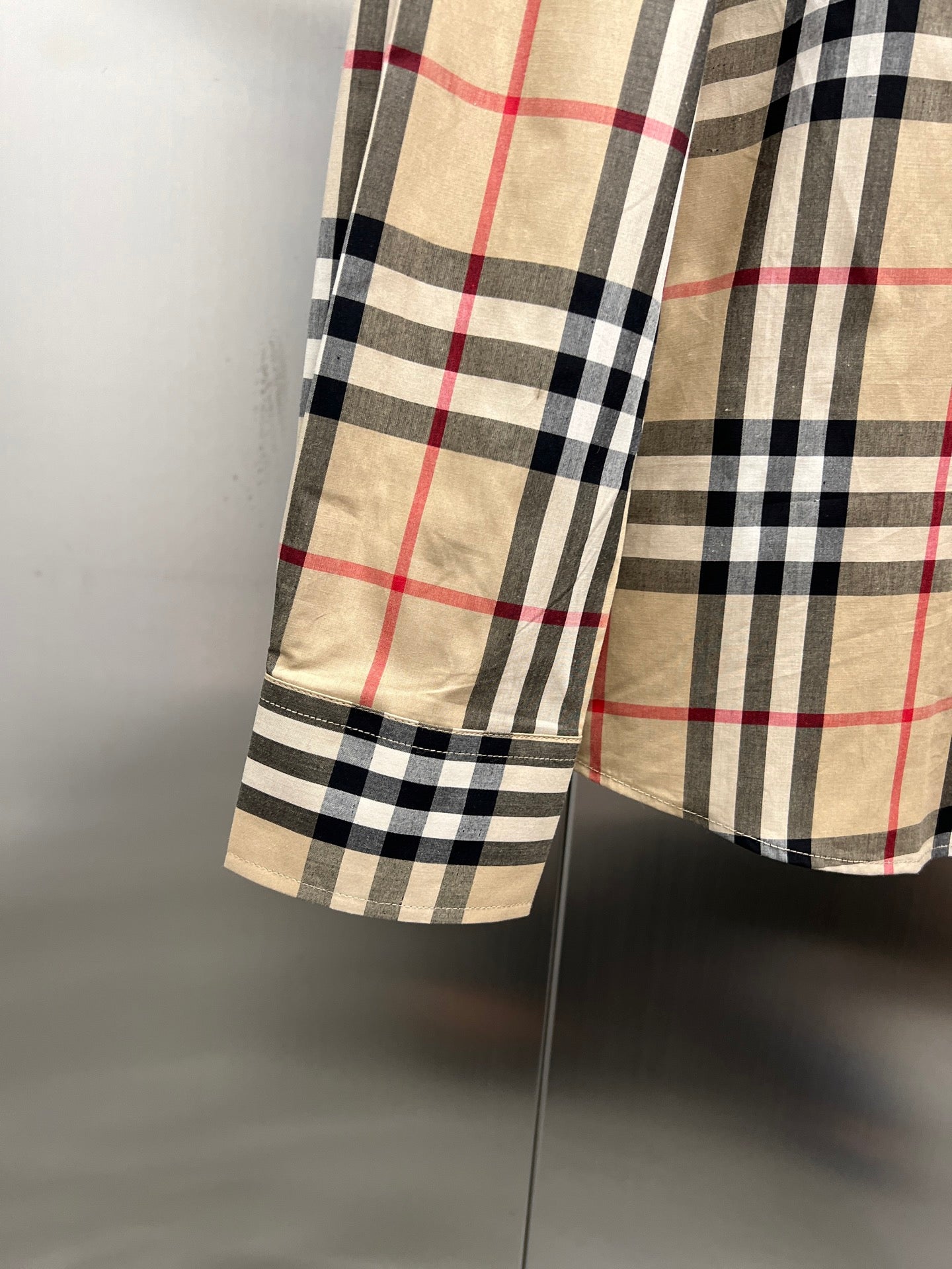 Burberry plaid shirt sleeve cuff and hem, side view