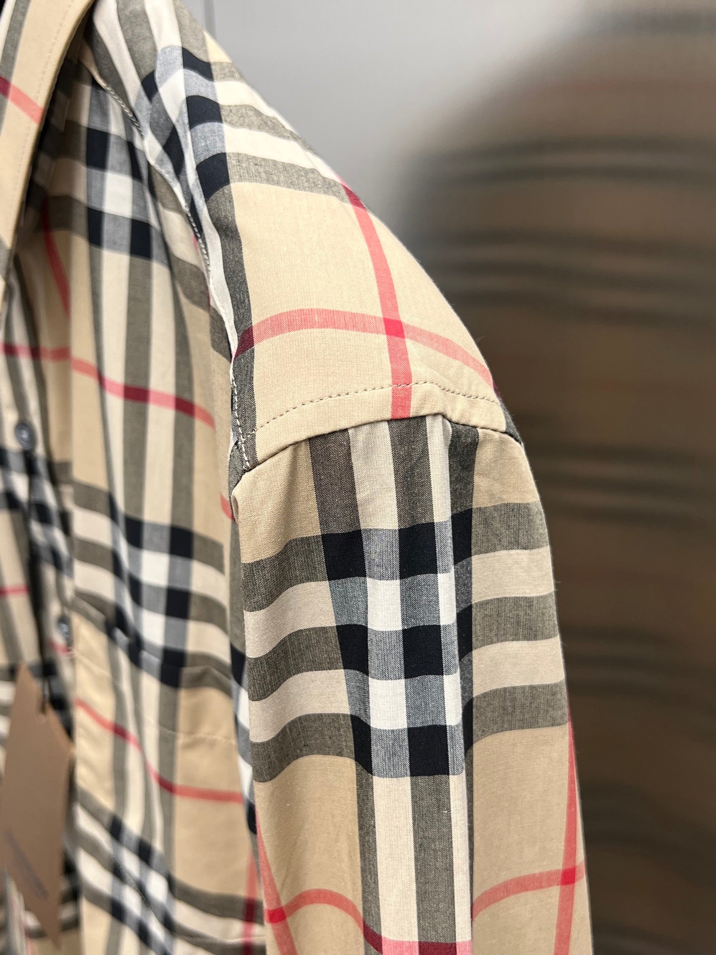 Burberry plaid long-sleeve shirt with stitched hem panel, side view