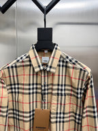 Burberry plaid button-up shirt with pointed collar, close-up front