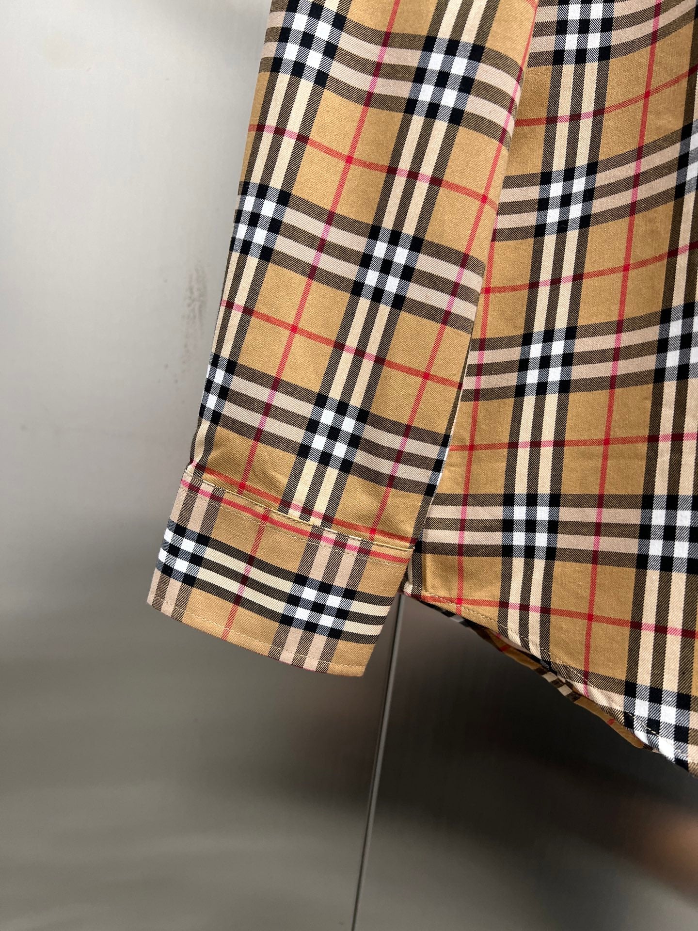 Burberry check button-up shirt hem and sleeve cuff detail