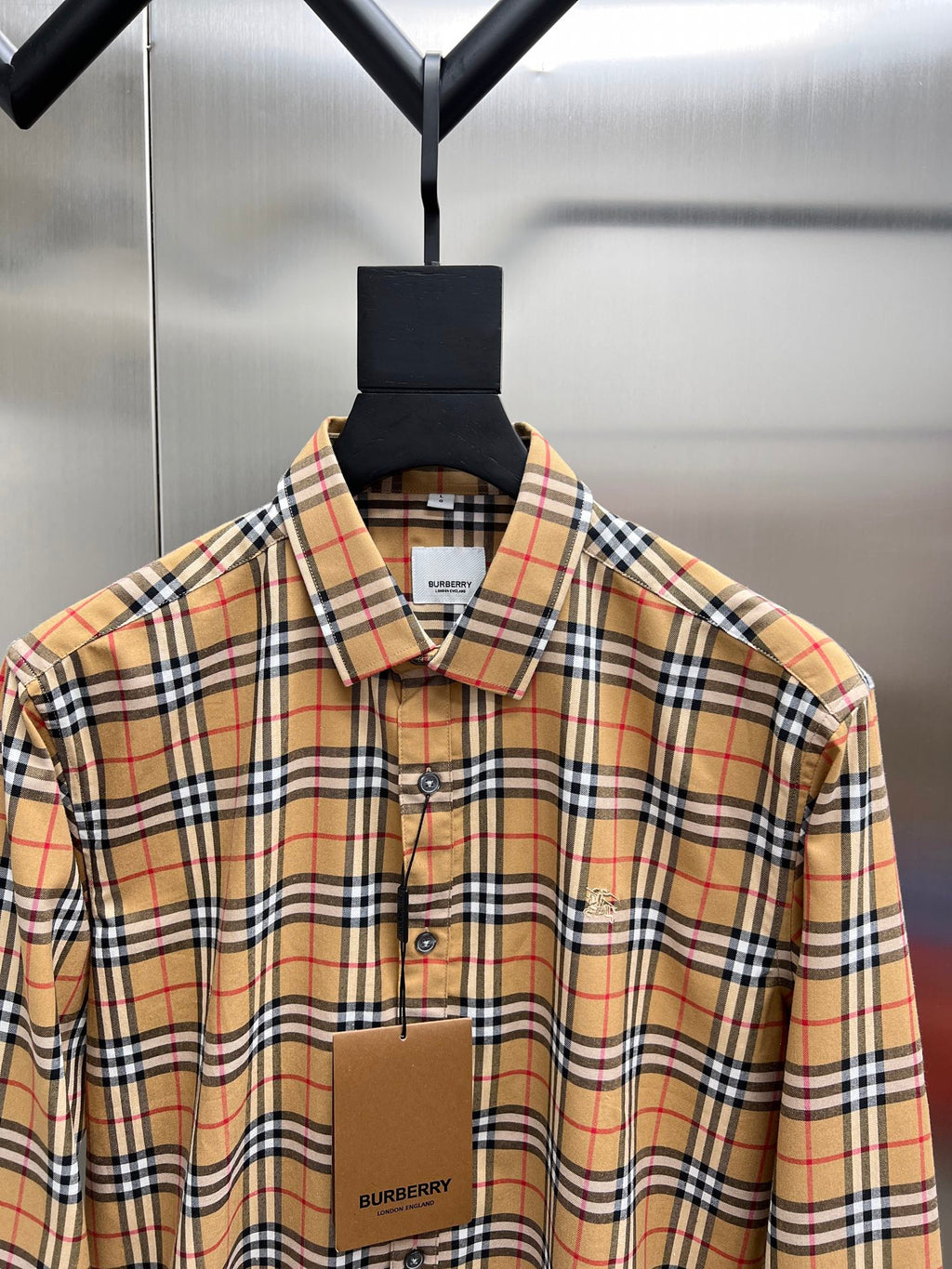 Burberry check button-up shirt close-up, button front and fold-over collar