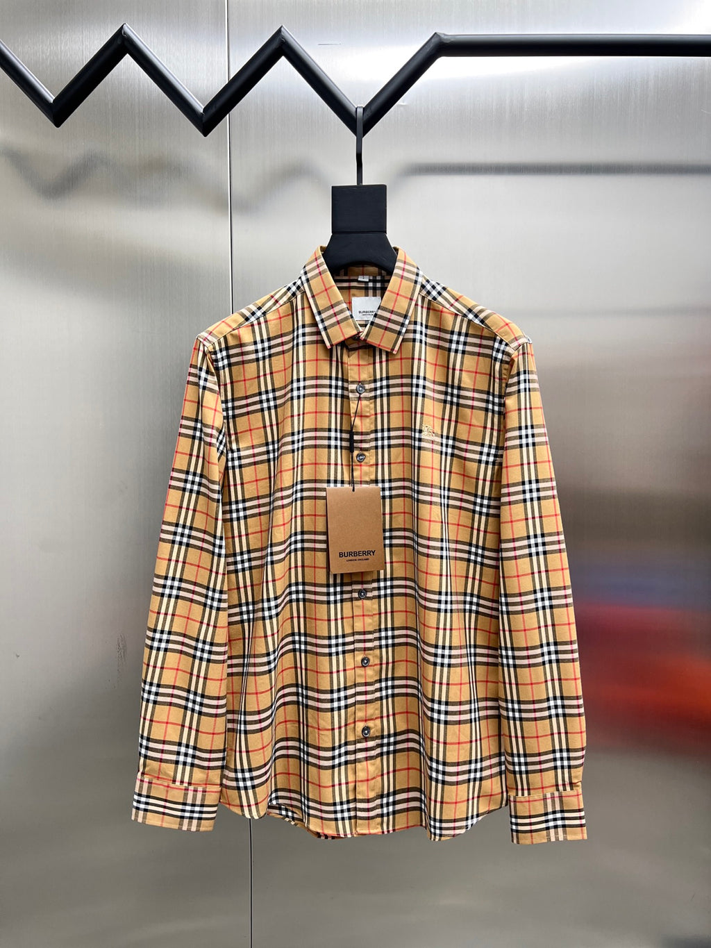 Burberry check button-up shirt with long sleeves, button front and collar