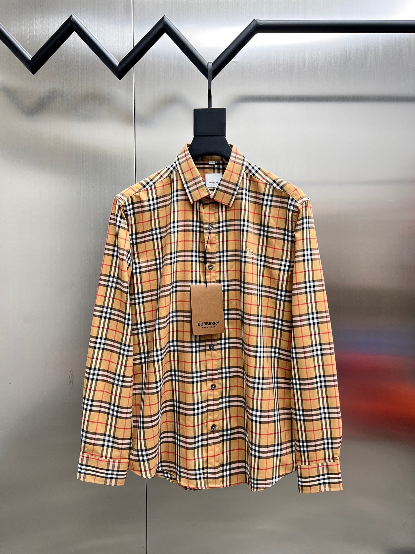 Burberry check button-up shirt with long sleeves, button front and collar
