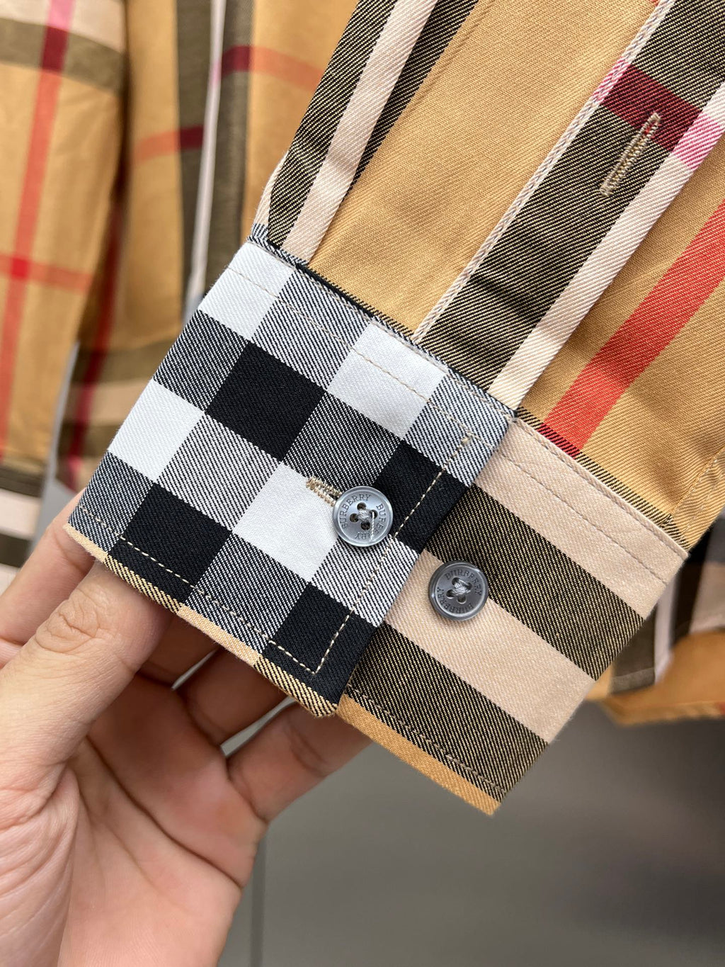 Long-sleeve check shirt in tan with black and white plaid, front with two buttons