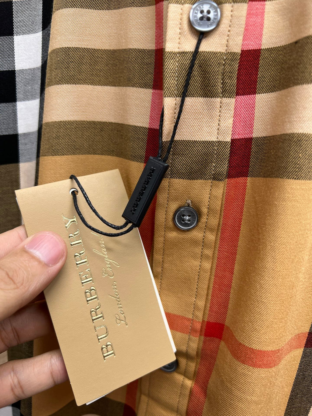 Burberry check shirt front button and attached product tags