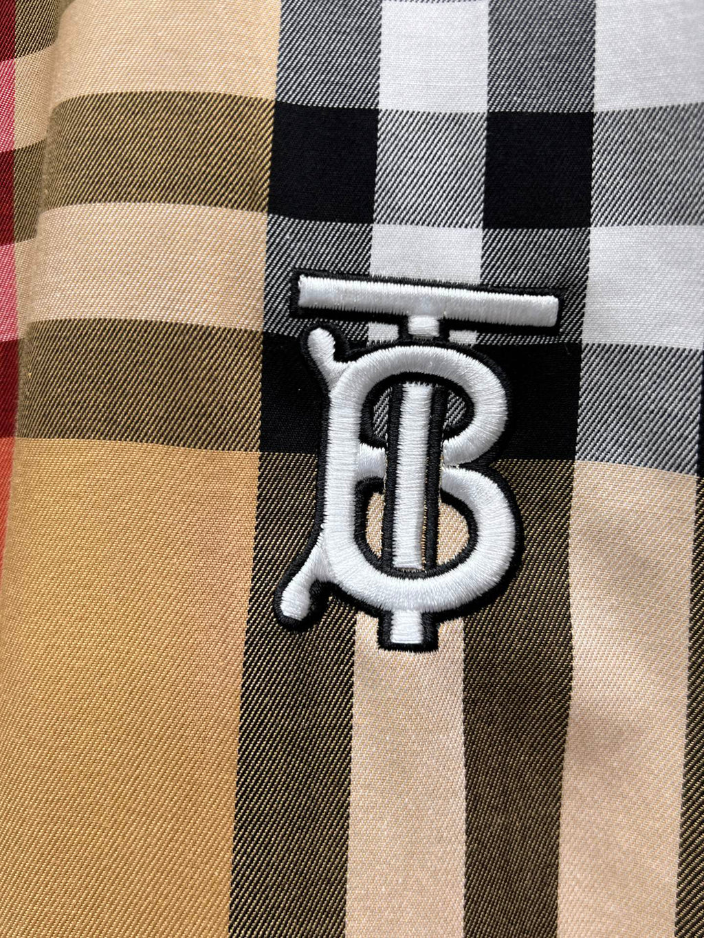 Burberry check shirt close-up of embroidered monogram logo