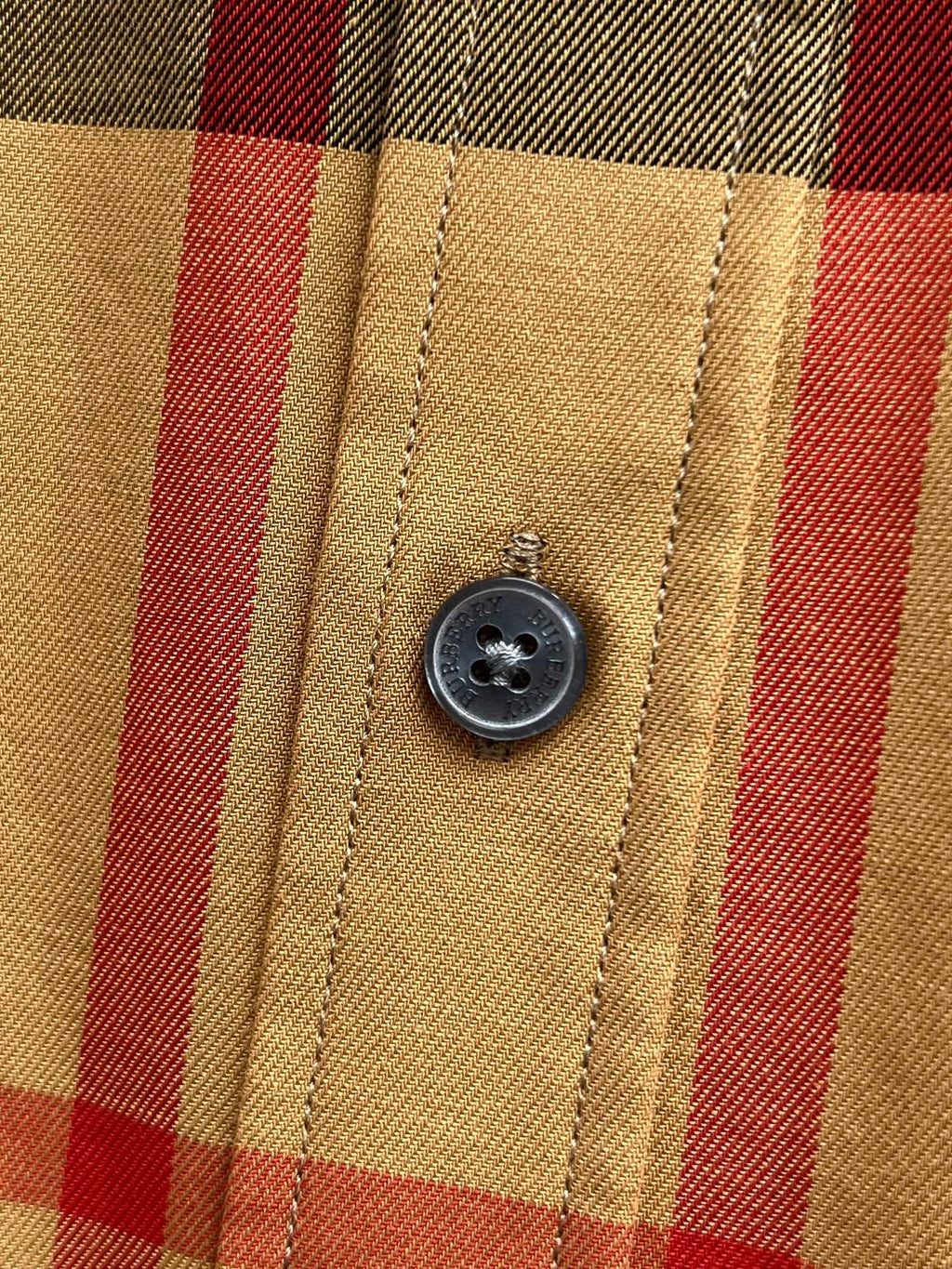 Burberry check shirt close-up of front button and placket stitching