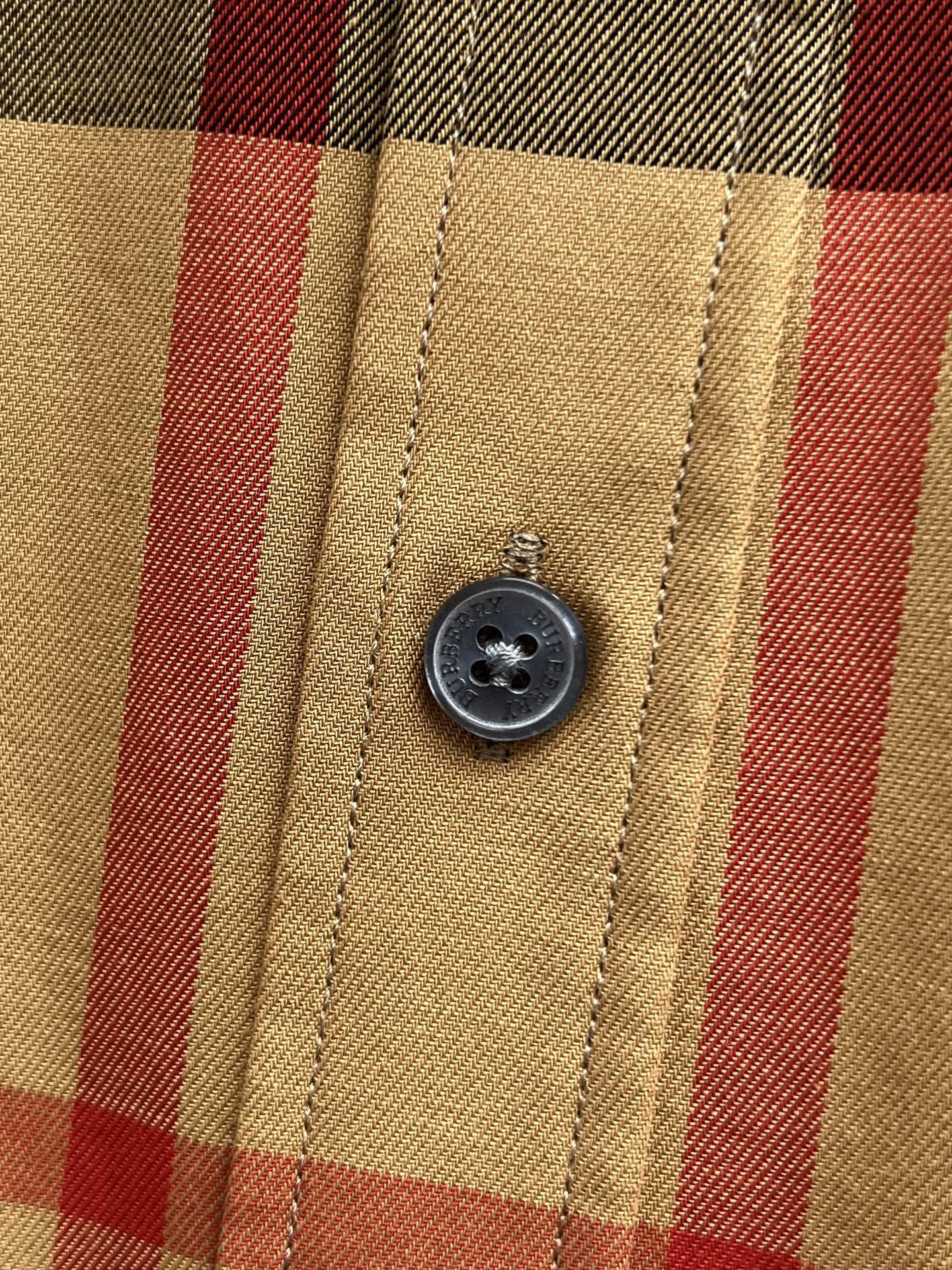 Burberry check shirt close-up of front button and placket stitching