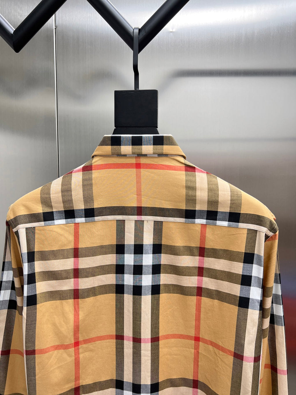 Long-sleeve check shirt back view in tan with red, black, and white plaid