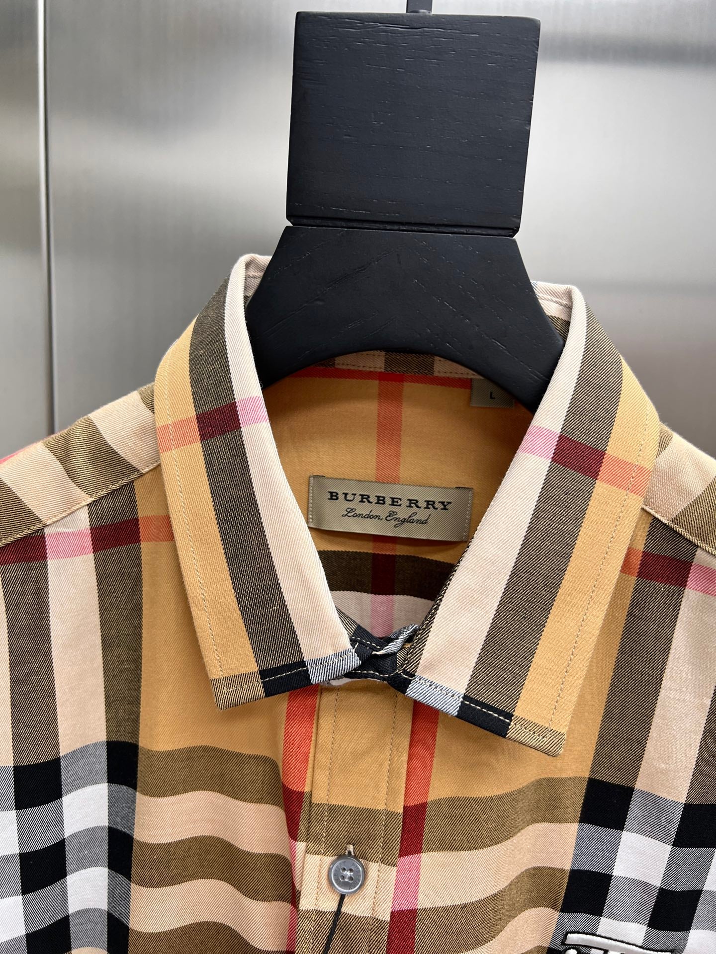 Burberry check shirt neckline and collar with visible interior tag