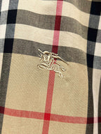 Burberry plaid shirt chest logo embroidery on tan fabric with red and navy checks