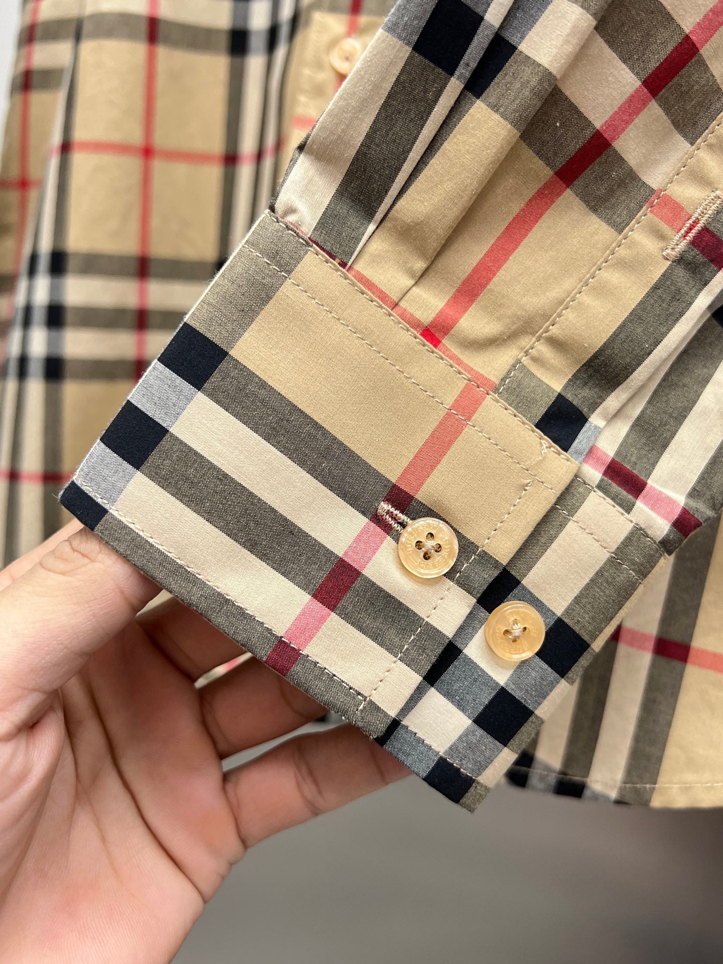 Plaid long-sleeve shirt cuff with two buttons, beige, navy, and red check