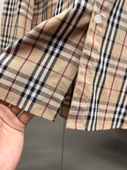 Plaid shirt cuff and sleeve edge with button detail