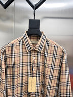 Plaid button-up shirt collar with visible buttons and neck label