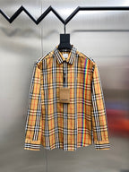 Plaid button-up shirt with spread collar, long sleeves, and front pockets on chest