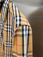 Plaid long-sleeve shirt side view with shoulder seam and sleeve placket