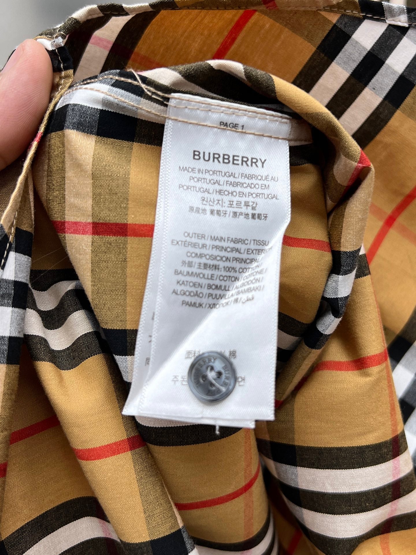 Burberry plaid long-sleeve shirt with inner size tag and buttoned collar, beige and black plaid