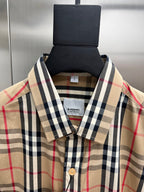Plaid button-up shirt collar and front placket with buttons, Burberry neck label