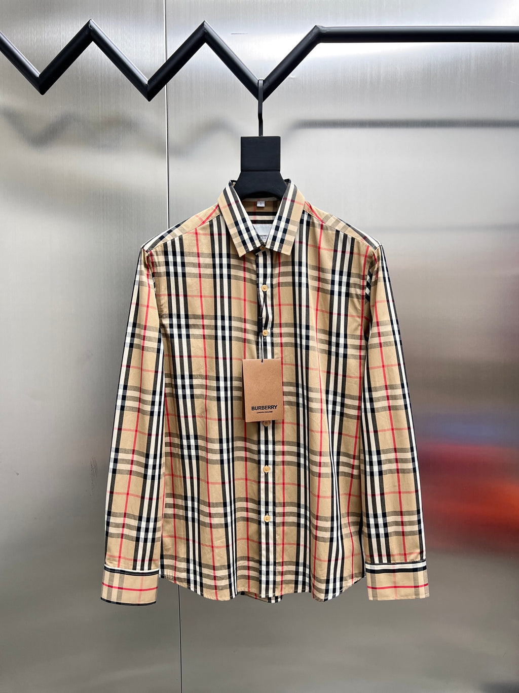 Plaid button-up shirt with pointed collar, long sleeves, front buttons, tan/black/red check
