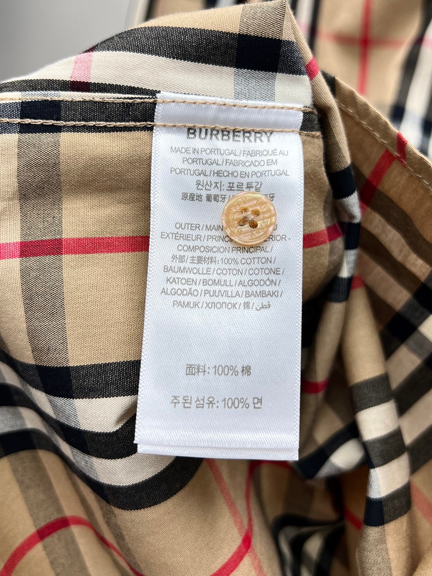 Burberry plaid shirt care label and fabric composition tag
