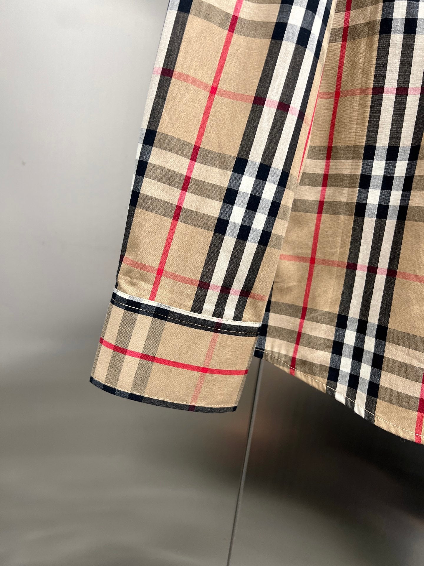 Plaid shirt side hem with stitched edge, long sleeve, tan/black/red check