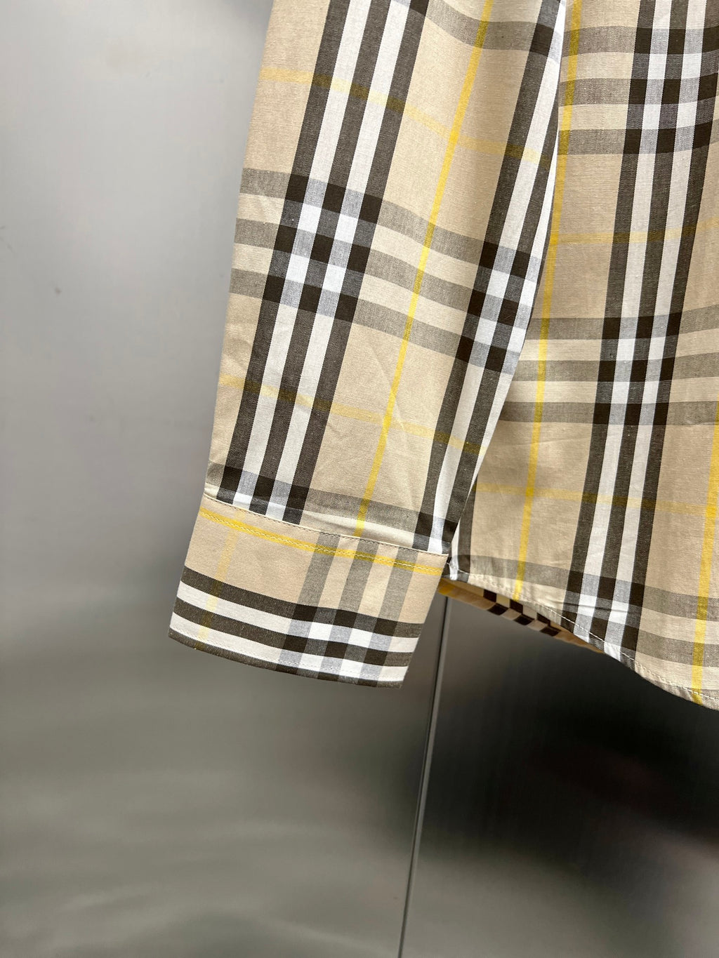 Plaid long-sleeve shirt hem and sleeve cuff, cream base with black and yellow stripe checks