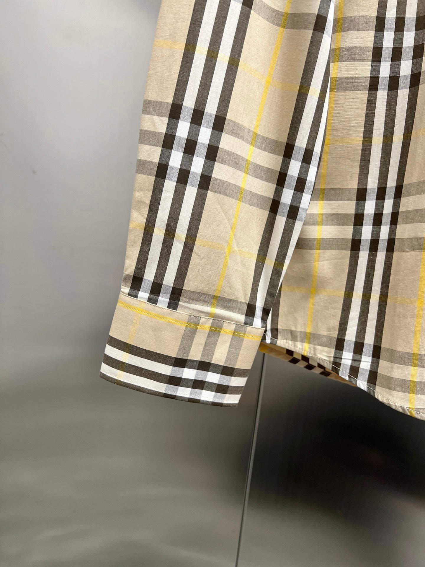 Plaid long-sleeve shirt hem and sleeve cuff, cream base with black and yellow stripe checks