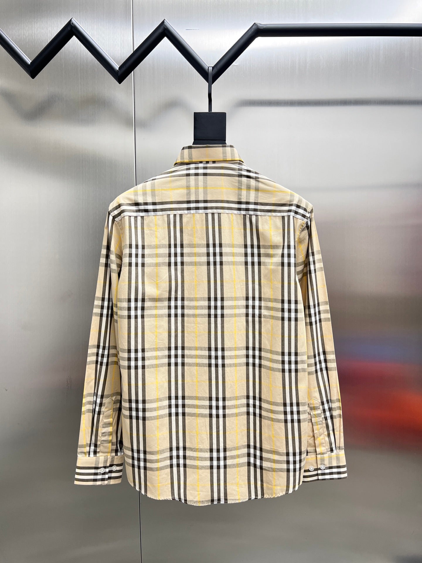 Long-sleeve plaid shirt, back view, cream base with black and yellow check pattern