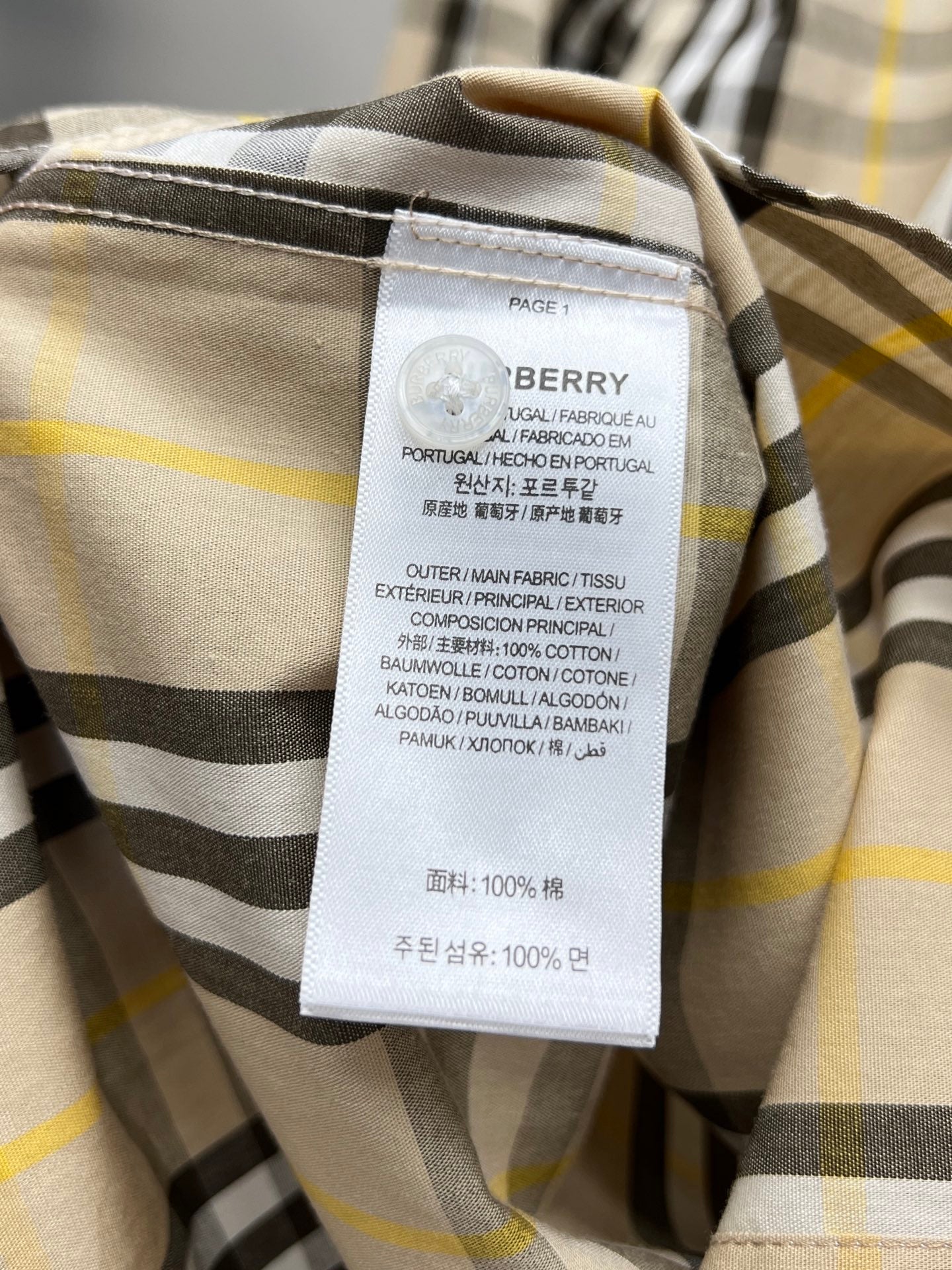 Burberry plaid shirt care label on inner collar