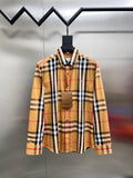 Long-sleeve plaid shirt on hanger, button-front and spread collar