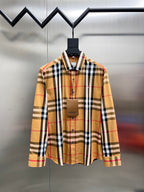 Long-sleeve plaid shirt on hanger, button-front and spread collar
