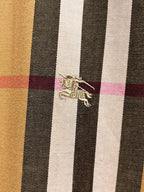 Embroidered logo on plaid long-sleeve shirt fabric panel